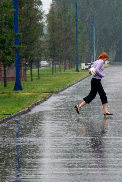 woman running under the rain